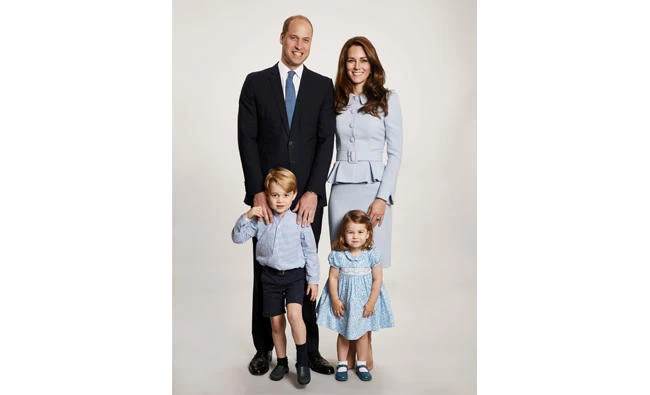Prince William, Catherine, and their two children Prince George and Princess Charlotte pose for their 2017 Christmas card.