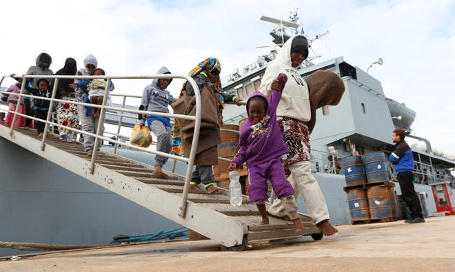 Migrants arrive at a naval base after they were rescued by Libyan coast guards in Tripoli, Libya, on Dec. 16, 2017. (Reuters)