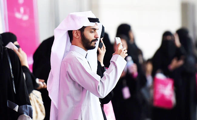 A Saudi man checks his mobile in the Saudi capital Riyadh, in this September 28, 2017 photo. (AFP)
