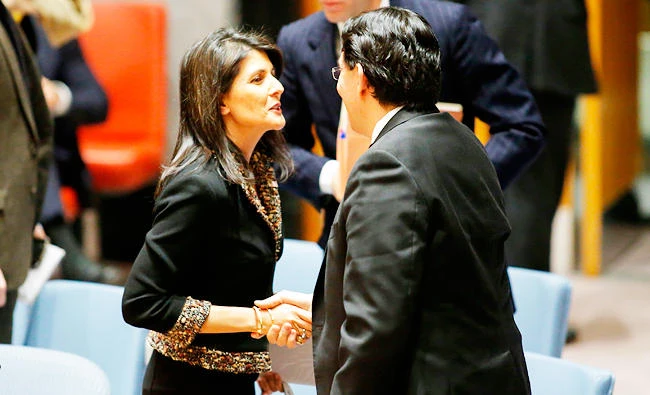 US Ambassador to the UN Nikki Haley speaks with UN Ambassador Danny Danon of Israel after a meeting on the situation in the Middle East on Monday, at UN Headquarters in New York. (AFP)