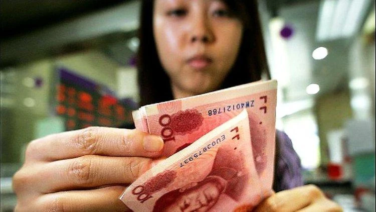 The Chinese Academy of Social Sciences said the world’s number two economy would expand 6.8 percent in 2017 and tick downwards to 6.7 percent next year. (AFP)