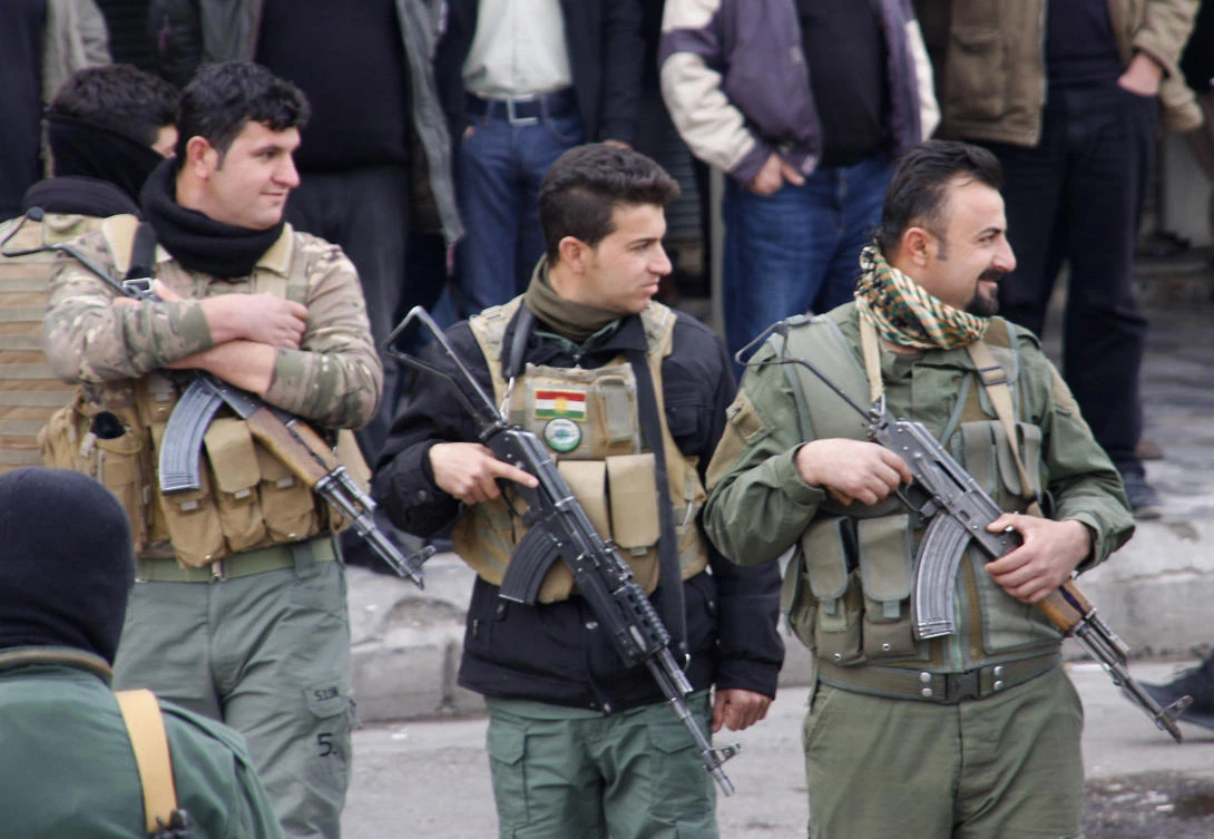 Above, Iraqi Kurdish security forces stand guard during a protest in Sulaimaniyah on December 19. Protesters have vented their anger against all five of the autonomous Kurdish region’s main political parties, who organized the September referendum. (AFP)