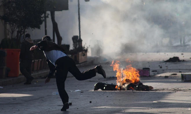 A Kurdish protester throws stone during a rally against the Kurdistan Regional Government (KRG) in Sulaimaniyah, Iraq, on Dec. 18, 2017. (Reuters)