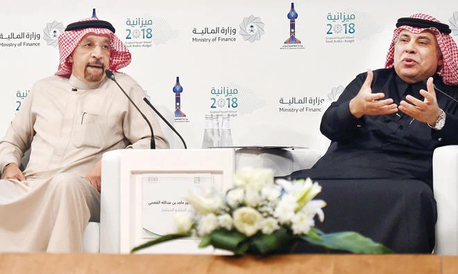 Saudi Arabia's minister of commerce and investment, Majid Al-Qassabi, right, speaks as Energy Minister Khalid Al-Falih listens on during a press conference on Wednesday in Riyadh. (AFP)
