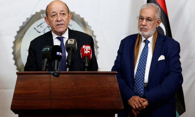 French Foreign Minister Jean-Yves Le Drian attends a joint news conference with Libya's Foreign Minister Mohamed Taher Siala, in Tripoli, on Thursday. (Reuters)