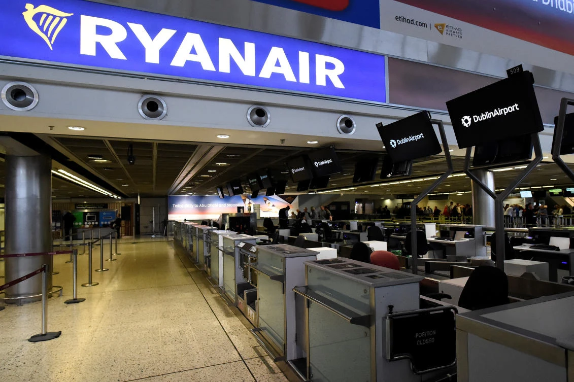 Above, an empty Ryanair check-in section of the departures area is seen at Dublin airport in Dublin. The Irish budget carrier had been seeking to avert a series of threatened strikes across Europe over Christmas last week by giving up its long-held opposition to recognizing unions. (Reuters)