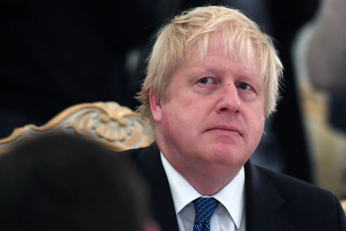 Above, British foreign secretary Boris Johnson attends a meeting with his Russian counterpart in Moscow on December 22. Johnson is the first foreign secretary to visit Moscow in more than five years. (AFP)