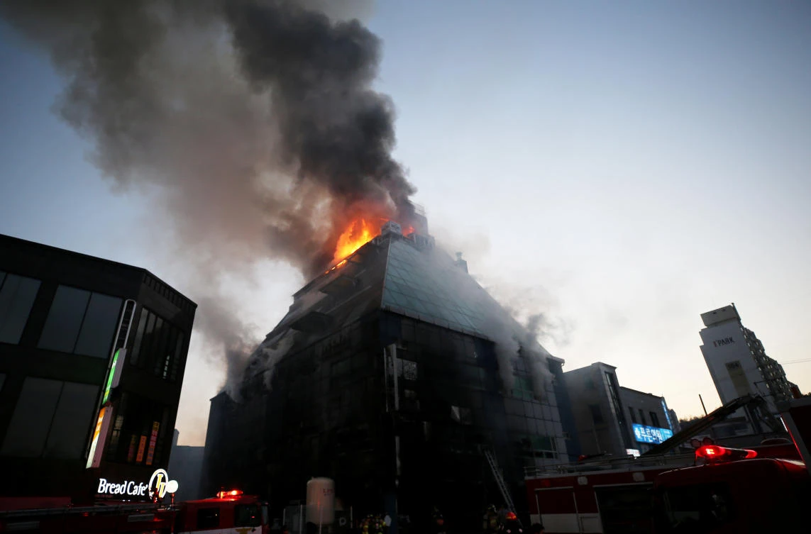Above, smoke rises from a burning building in Jecheon. Investigators were still trying to find out the cause of the conflagration, but were focusing on a first-floor parking lot. (Reuters)