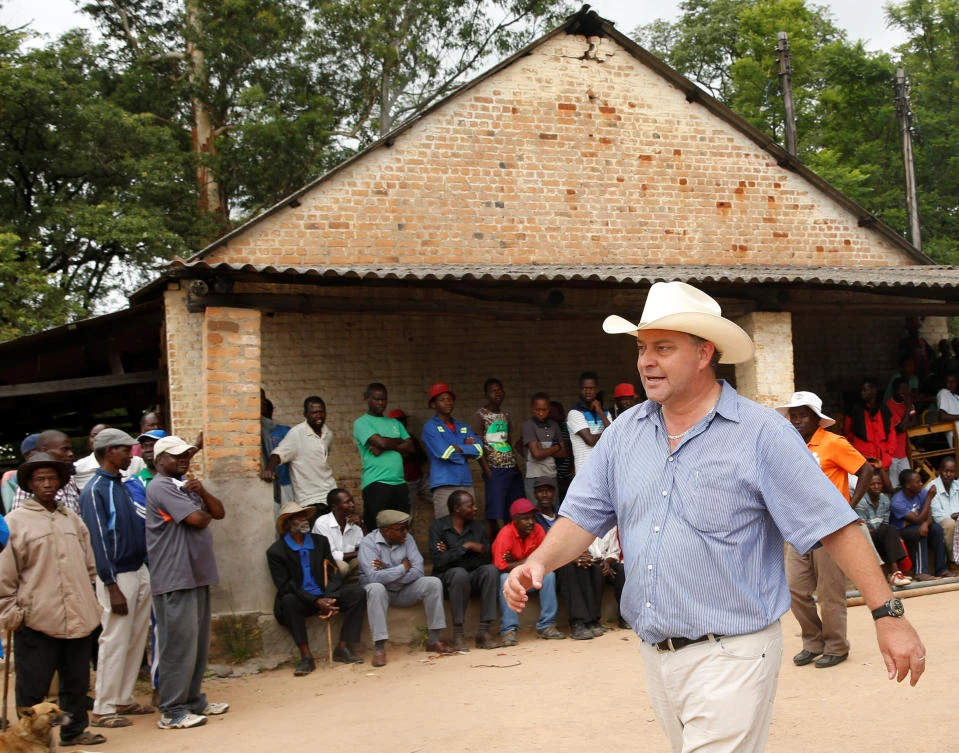 1st white farmer gets land back under Zimbabwe’s new leader
