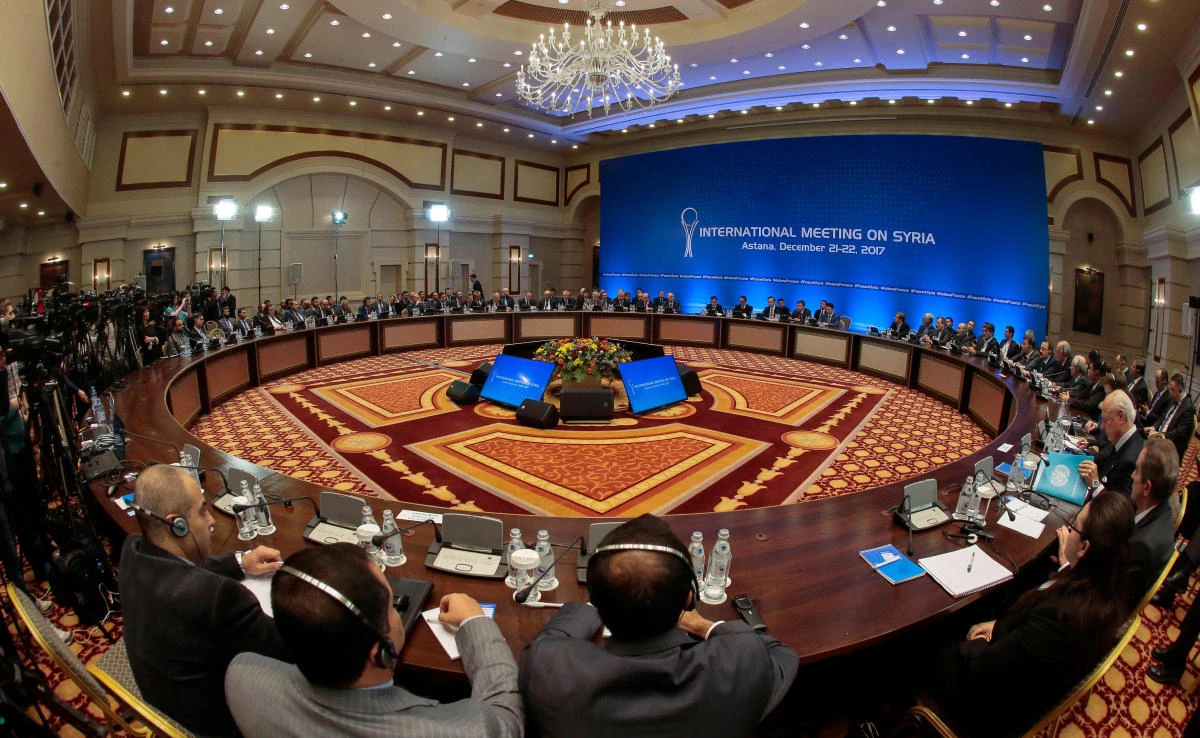 Syrian regime representatives and opposition delegates along with other attendees take part in the session of Syria peace talks in Astana on Dec.22, 2017. (AFP)