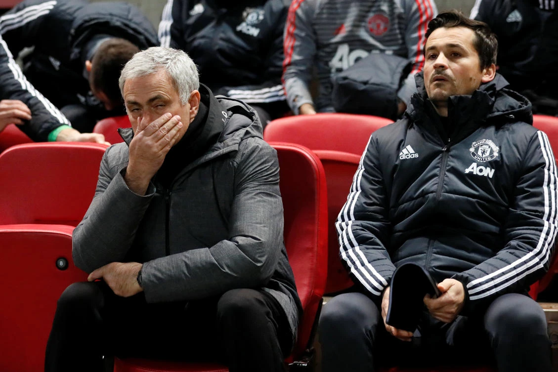 Manchester United manager Jose Mourinho and assistant manager Rui Faria rue the League Cup defeat at Bristol City. (Reuters)