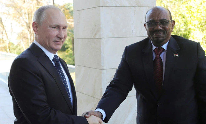 Russian President Vladimir Putin shakes hands with Sudan's President Omar al-Bashir during their meeting in the Black Sea resort of Sochi, Russia. (Sputnik via Reuters)