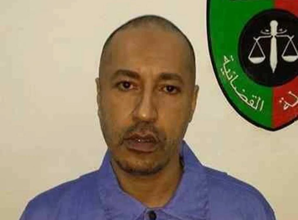 In this file photo, Saadi Qaddafi, son of Muammar Qaddafi, looks on inside a prison in Tripoli on Mar. 6, 2014. (Reuters)
