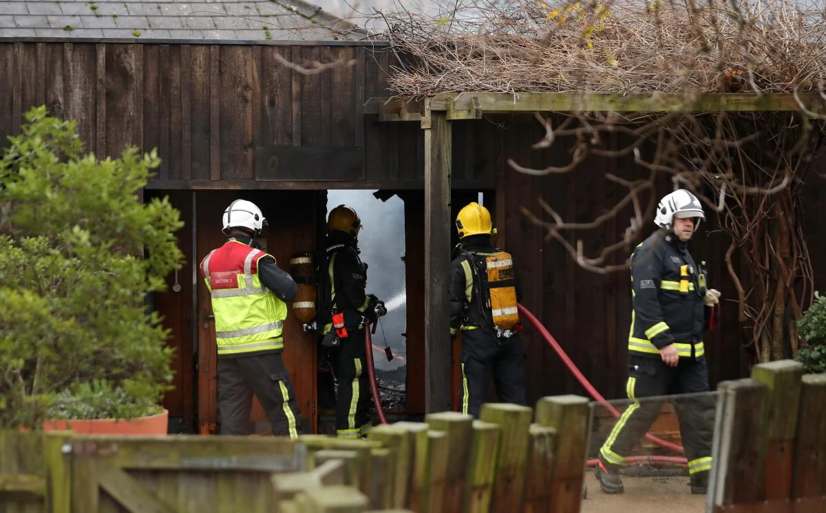 Firefighters control a blaze that broke out at a cafe and shop at London Zoo in London on December 23. It took more than 70 firefighters more than three hours to bring the fire under control, the London Fire Brigade said. (AFP)