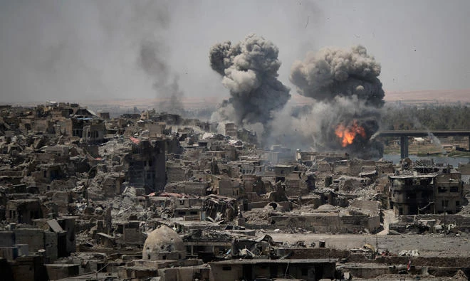 In this July 11 file photo, airstrikes target Daesh positions on the edge of the Old City in Mosul, Iraq. (AP)