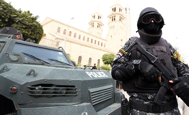 A special forces police officer stands guard to secure the area around Saint Mark's Coptic Orthodox Cathedral before a Coptic Christmas mass in Cairo, in this file photo taken on January 6, 2015. (Reuters)