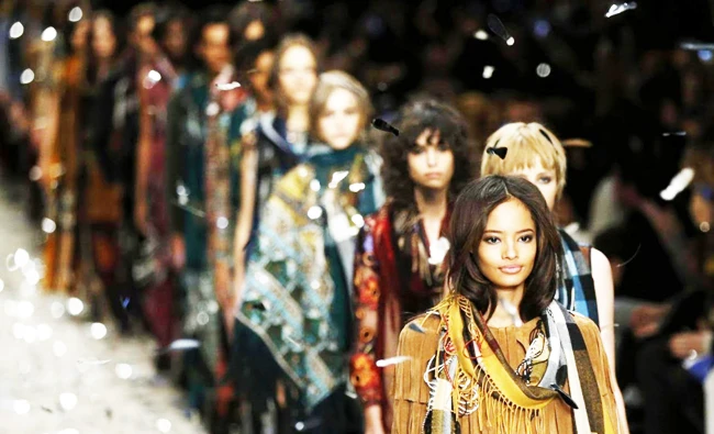 Models present creations from Burberry at London Fashion Week. Efforts are underway to stem the exodus of design talent from the Kingdom to Dubai, London and Paris. (Reuters)