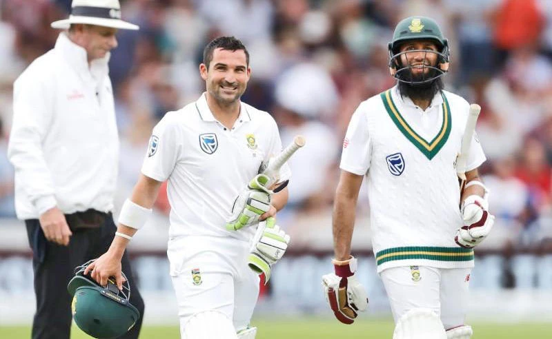 This file photo shows South Africa’s Hashim Amla, right, and Dean Elgar during the innings break in their match against England in Nottingham on July.16, 2017. (Action Images via Reuters)