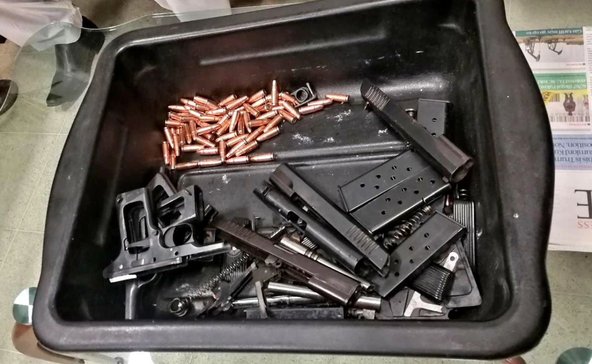 This photo circulated by Airport Security Force shows weapons that were carried by Malaysian national, Al Muhd Alfie Kqhyriel, at the Jinnah International Airport in Karachi on Friday, Dec.22, 2017. (Handout photo by ASF)