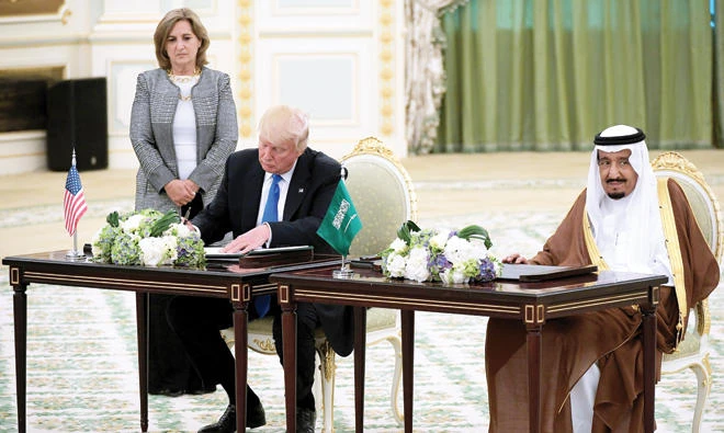 Saudi King Salman and US President Donald Trump take part in a signing ceremony at the Royal Court in Riyadh on May 20. (AFP)