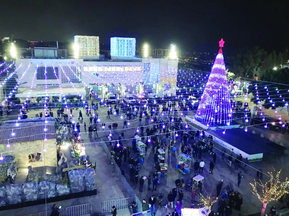 Palestinians celebrate Christmas in Bethlehem on Sunday. (AN photo)