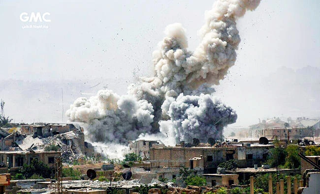 This file photo taken on Sept 25, 2017, by the Ghouta Media Center, a Syrian activist media group, shows smoke and debris rising after Syrian government shelling of the rebel-held Jobar neighborhood of Damascus, Syria. (AP)