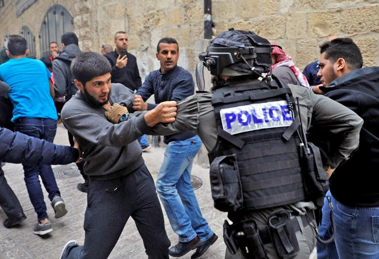In this undated file photo, Israeli security forces face Palestinians in Old City of Jerusalem. (AFP)