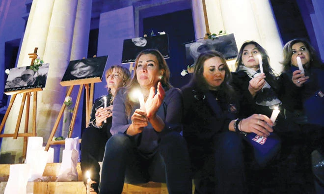 Dozens of people gathered outside Beirut’s national museum on Saturday evening to light candles for a British woman and three Arab women murdered in the past week in Lebanon. (Reuters)