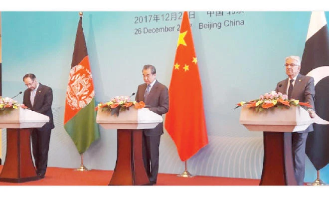 Foreign Minister Wang Yi of China, center, is flanked by Afghanistan’s Foreign Minister Salahuddin Rabbani, left, and Pakistani Foreign Minister Khawaja Asif during the First China-Afghanistan-Pakistan Foreign Ministers’ Dialogue. (Photo courtesy: Ministry of Foreign Affairs — Islamabad)