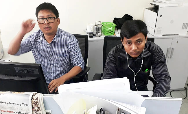 Reuters journalists Wa Lone (L) and Kyaw Soe Oo, who are based in Myanmar, pose for a photo at the Reuters office in Yangon, Myanmar, in this December 11, 2017 photo. (REUTERS)