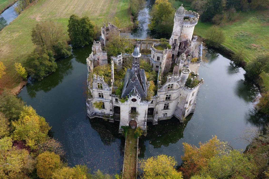 An aerial view of the 19th-century chateau de La Mothe-Chandeniers, which is now owned by around 25,000 people from 115 countries through a crowndfunding aimed to buy and restore the structure. (AFP)