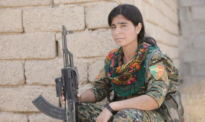 A Yazidi female of Sinjar Resistance Units (YBS) holds her rifle at Sinjar mountain, Iraq. (Reuters/file)