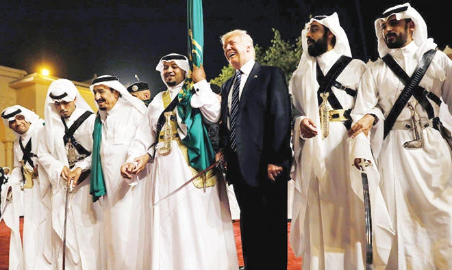 US President Donald Trump dances with a sword as he arrives at a welcome ceremony by Saudi Arabia’s King Salman at Al-Murabba Palace in Riyadh on May 20, 2017. (Reuters)