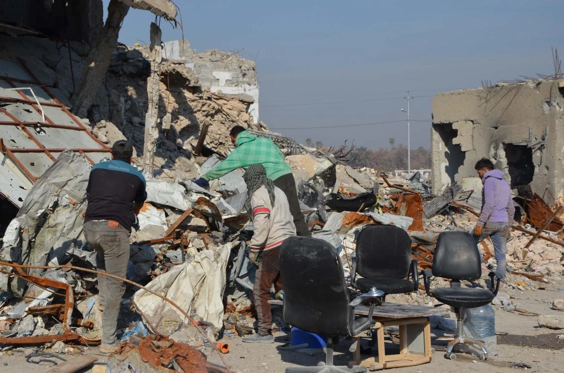 Above, Iraqi volunteers salvage and clean up the debris and destruction in Mosul. (AFP)