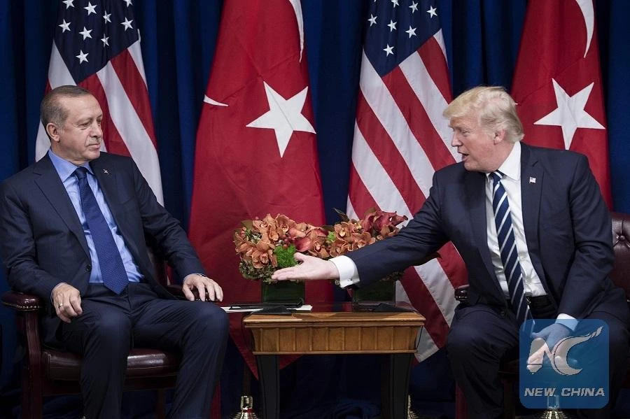 US President Donald Trump reaches to shake Turkey's President Recep Tayyip Erdogan's hand before a meeting at the Palace Hotel during the 72nd United Nations General Assembly on September 21, 2017 in New York City. (AFP)