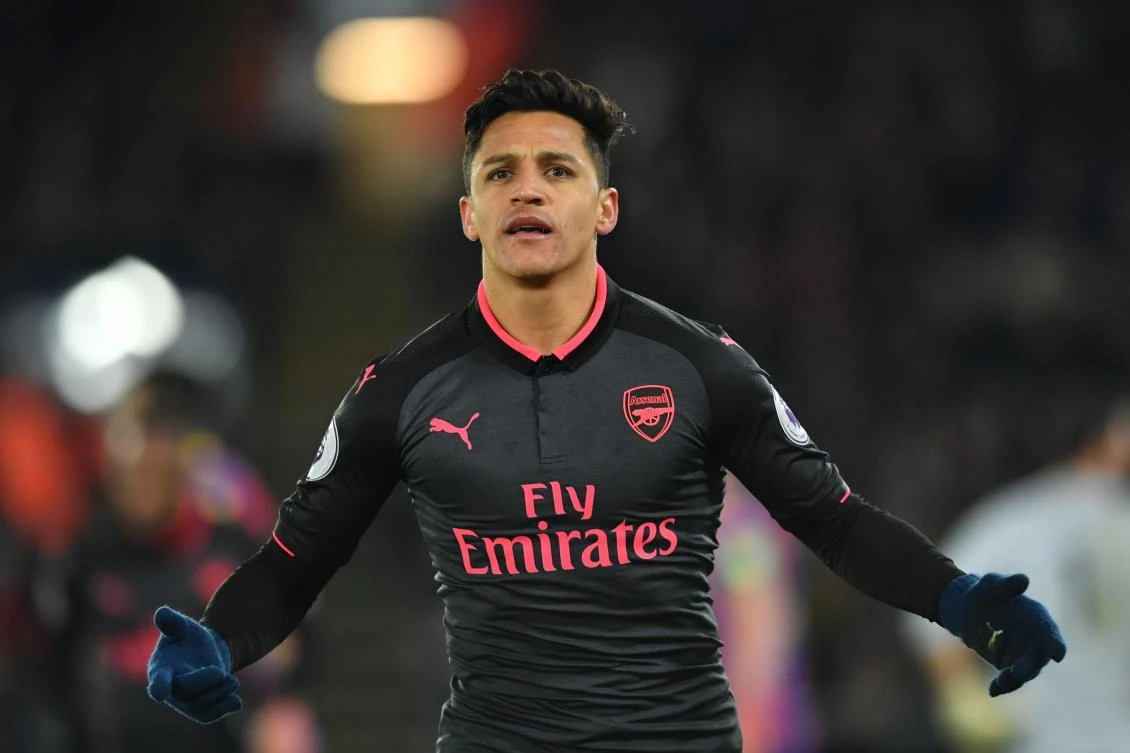 TOPSHOT - Arsenal's Chilean striker Alexis Sanchez celebrates after scoring their third goal during the English Premier League football match between Crystal Palace and Arsenal at Selhurst Park in south London on December 28, 2017. RESTRICTED TO EDITORIAL USE. No use with unauthorized audio, video, data, fixture lists, club/league logos or 'live' services. Online in-match use limited to 75 images, no video emulation. No use in betting, games or single club/league/player publications. / AFP / Ben STANSALL / RESTRICTED TO EDITORIAL USE. No use with unauthorized audio, video, data, fixture lists, club/league logos or 'live' services. Online in-match use limited to 75 images, no video emulation. No use in betting, games or single club/league/player publications.