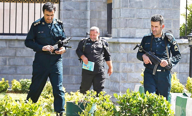 Police officers patrol Iran's parliament building in Tehran, Iran, in this June 7, 2017 photo. (AP)