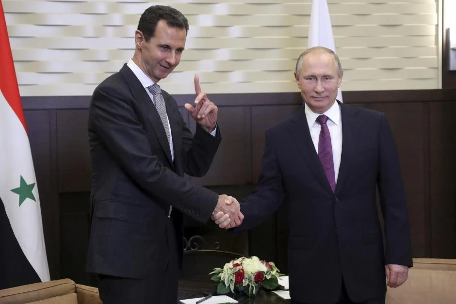 Russian President Vladimir Putin, right, meets with Syrian President Bashar Al-Assad in the Black Sea resort of Sochi on November 20. Russia first launched air strikes in Syria in September 2015 in its biggest Middle East intervention in decades, turning the tide of the conflict in Assad’s favor. (Reuters)
