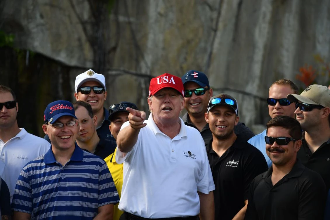US President Donald Trump speaks to service members of the US Coast Guard during an invitation to play golf at Trump International Golf Course in Mar-a-Lago, Florida on Friday, December 29. (AFP)