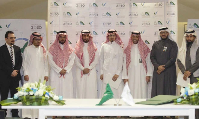 Owners of the startup companies pose for a group photo during the event in Riyadh.