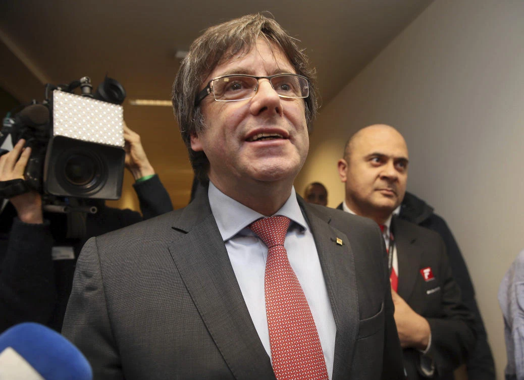 Fugitive Catalan leader asks Spain to restore his government