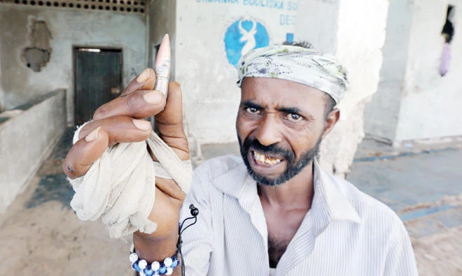 A Somali displays a bullet during clashes between military and police in Mogadishu. (File photo/Reuters)
