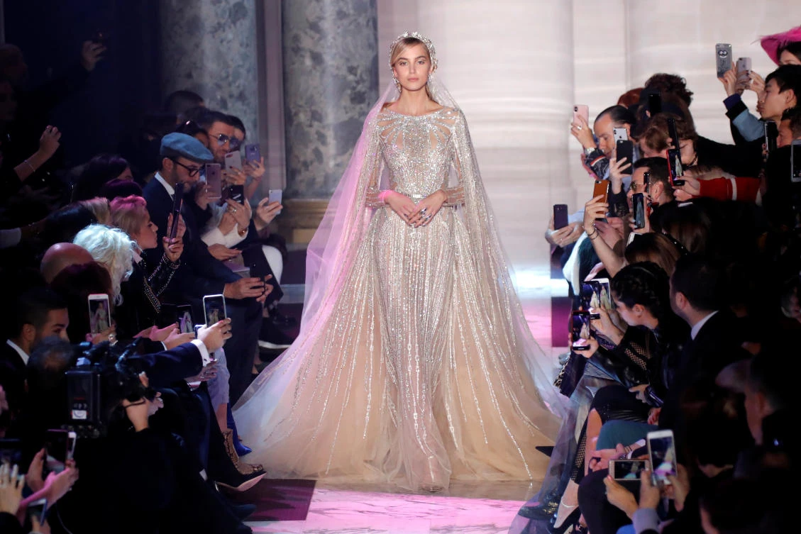 A model presents a wedding dress by designer Elie Saab as part of his Haute Couture Spring-Summer 2018 fashion show in Paris, France, January 24, 2018. REUTERS/Charles Platiau