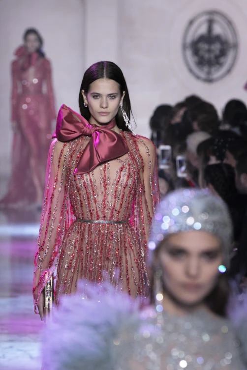 Models wear creations for Elie Saab's Haute Couture Spring-Summer 2018 fashion collection presented in Paris, Wednesday, Jan. 24, 2018. (AP Photo/Kamil Zihnioglu)
