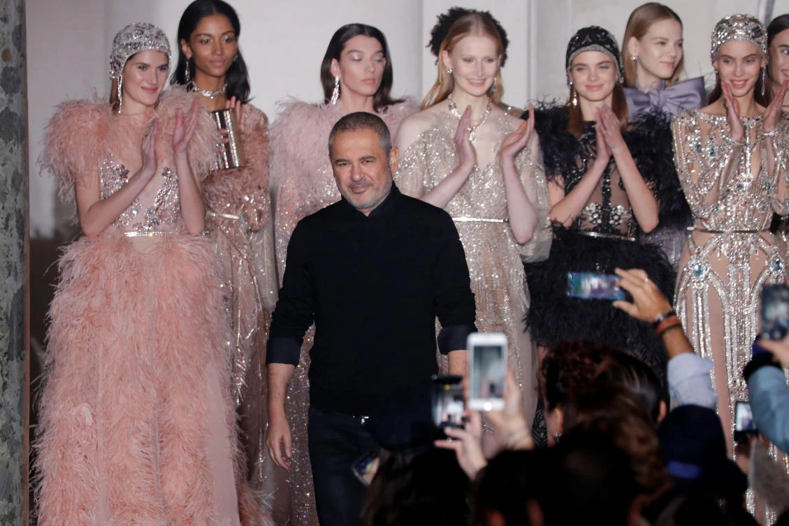 Designer Elie Saab appears at the end of his Haute Couture Spring-Summer 2018 fashion show in Paris, France, January 24, 2018. REUTERS/Charles Platiau