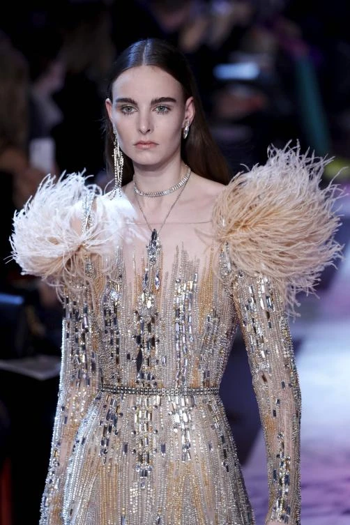 A model presents a creation by Elie Saab during the 2018 spring/summer Haute Couture collection fashion show on January 24, 2018 in Paris. / AFP / Patrick KOVARIK