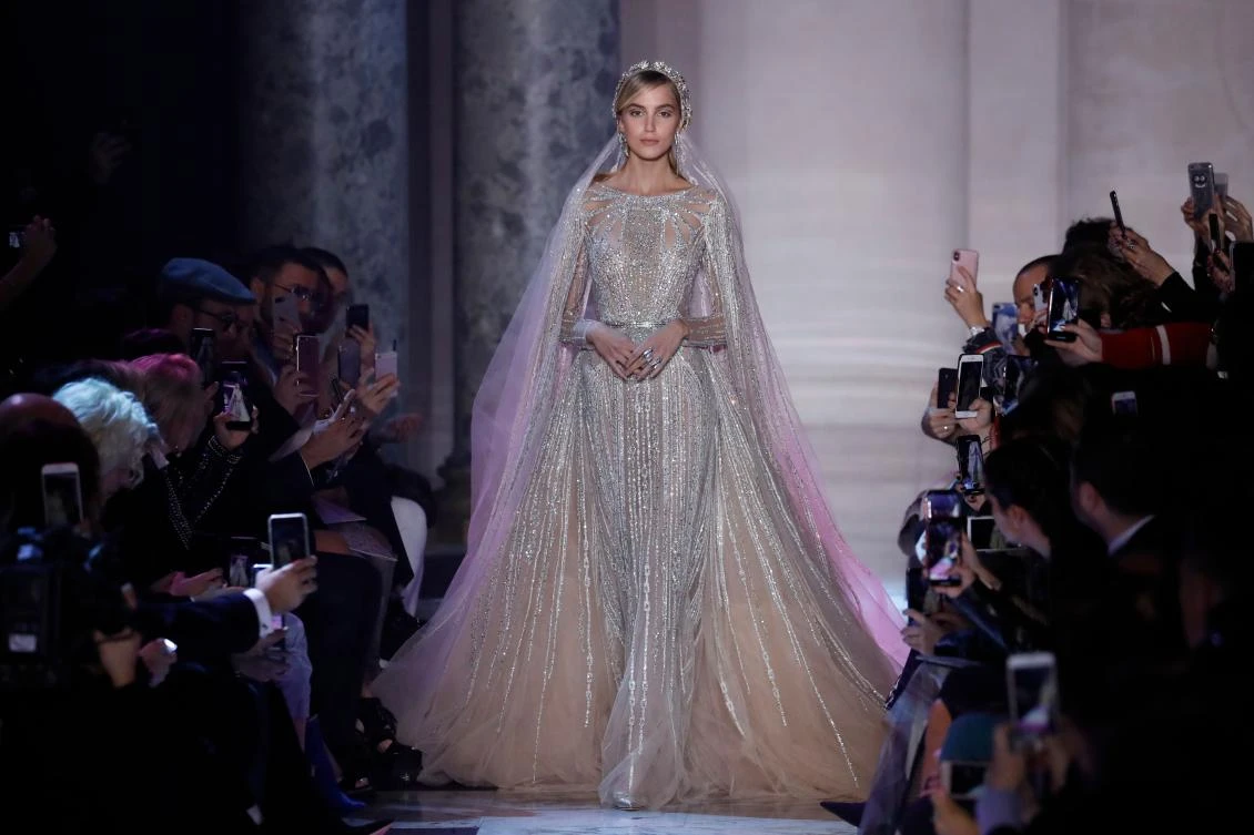 TOPSHOT - A model presents a creation by Elie Saab during the 2018 spring/summer Haute Couture collection fashion show on January 24, 2018 in Paris. / AFP / Patrick KOVARIK