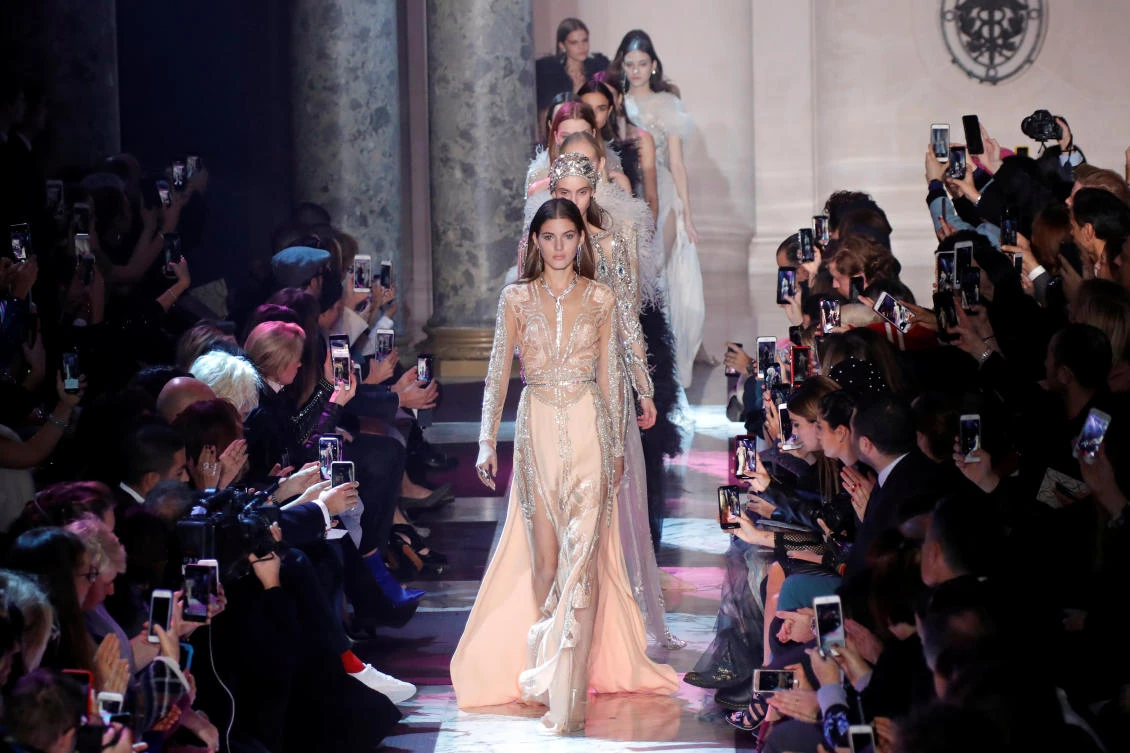 Models present creations by designer Elie Saab as part of his Haute Couture Spring-Summer 2018 fashion show in Paris, France, January 24, 2018. REUTERS/Charles Platiau