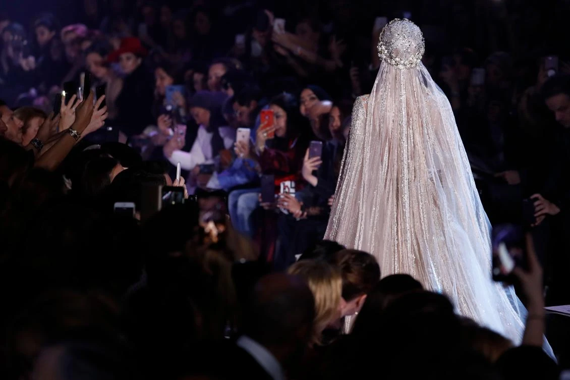 A model presents a creation by Elie Saab during the 2018 spring/summer Haute Couture collection fashion show on January 24, 2018 in Paris. / AFP / Patrick KOVARIK