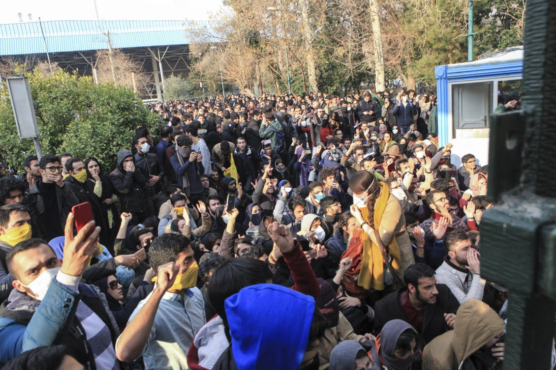 In this Saturday, Dec. 30, 2017 file photo taken by an individual not employed by the Associated Press and obtained by the AP outside Iran, university students attend a protest inside Tehran University while anti-riot Iranian police prevent them to join other protesters, in Tehran, Iran. As protests over Iran’s faltering economy rapidly spread across the country, a channel on a mobile messaging app run by an exiled journalist helped fan the passions of some of those who took to the street. The Telegram app shut down a channel run by Roohallah Zam after Iranian authorities complained that it was inciting violence. (AP Photo, File)
